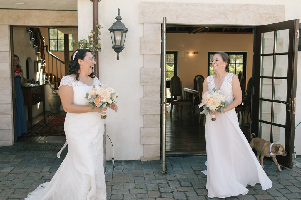 two brides as they see each other for the first time on their wedding day in carmel 