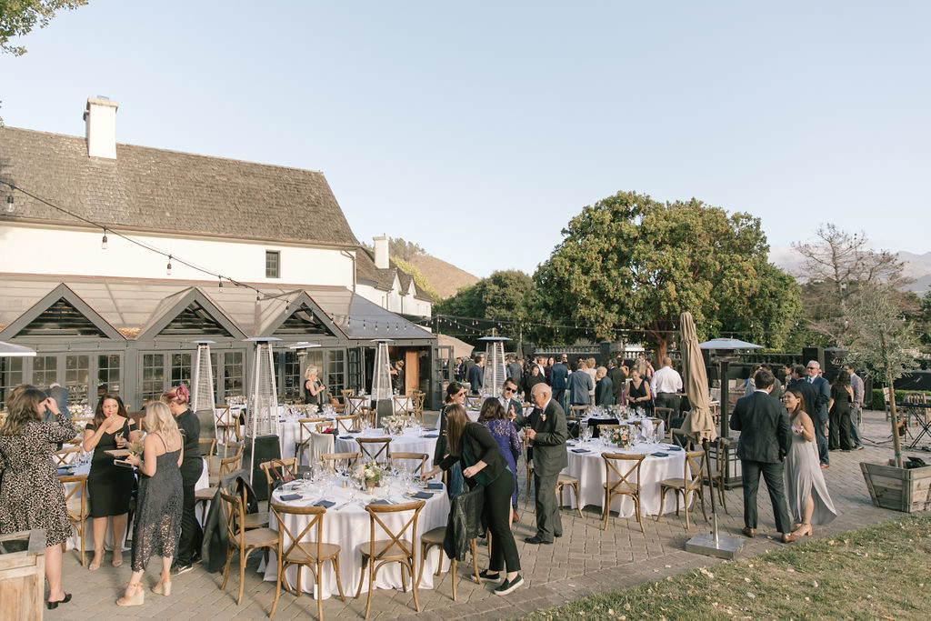 wedding guests gathering at the al fresco dinner reception in carmel at Folktale Winery