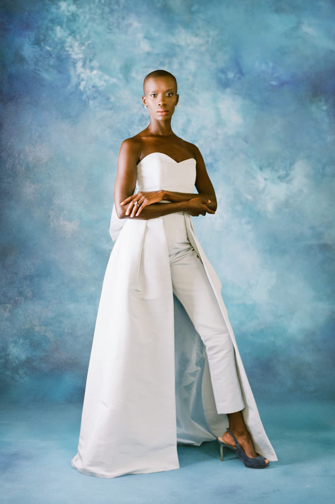 Black model with blue convertible wedding jumpsuit