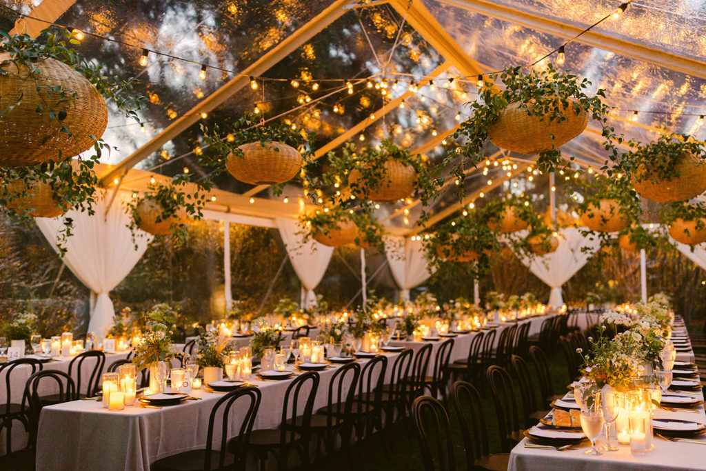 Candlelit Reception Tent with Hanging Lanterns and Greenery