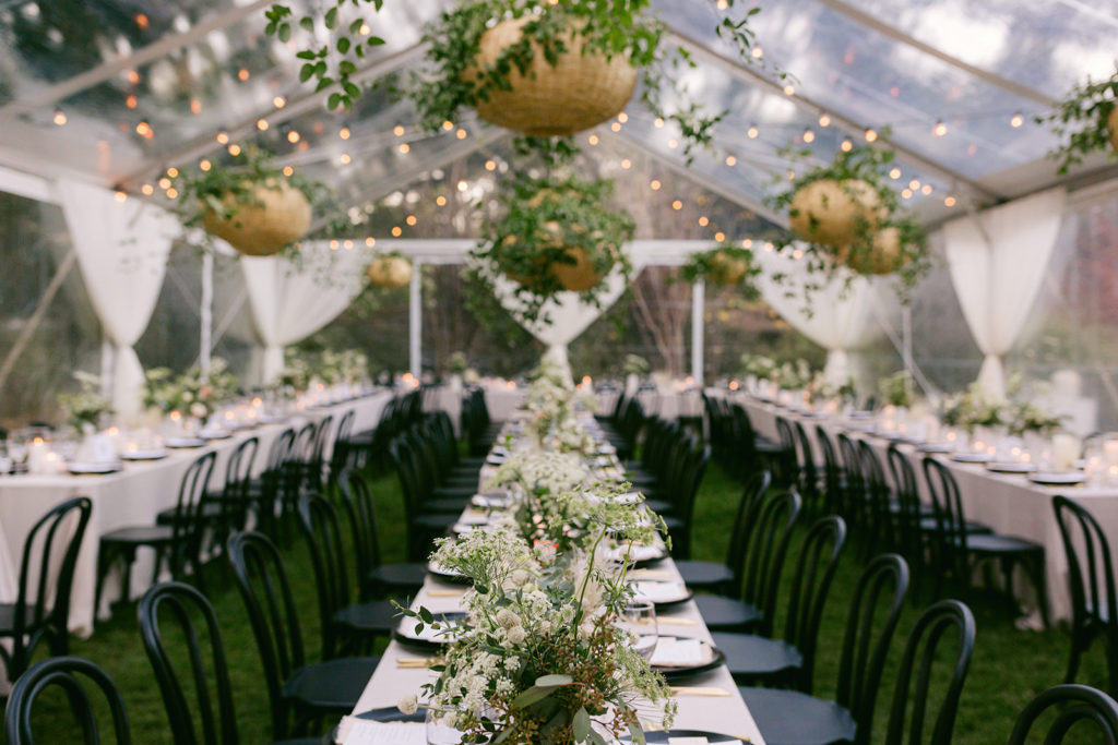 Reception Tables with Greenery and Black Chairs on Gardener Ranch Woodlawn Lawn